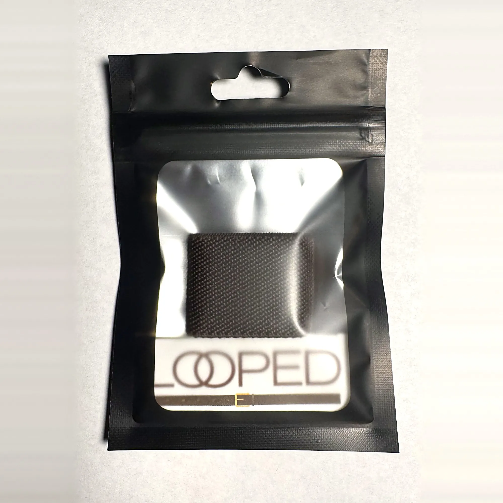 Brown Looped in its retail pouch