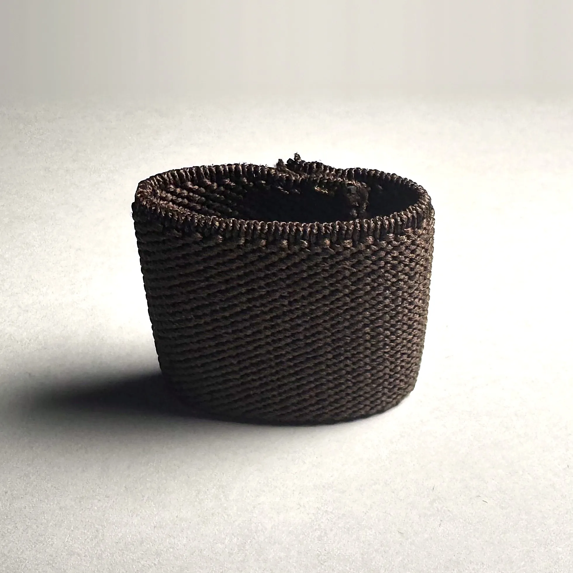 Brown Looped standing on a light background